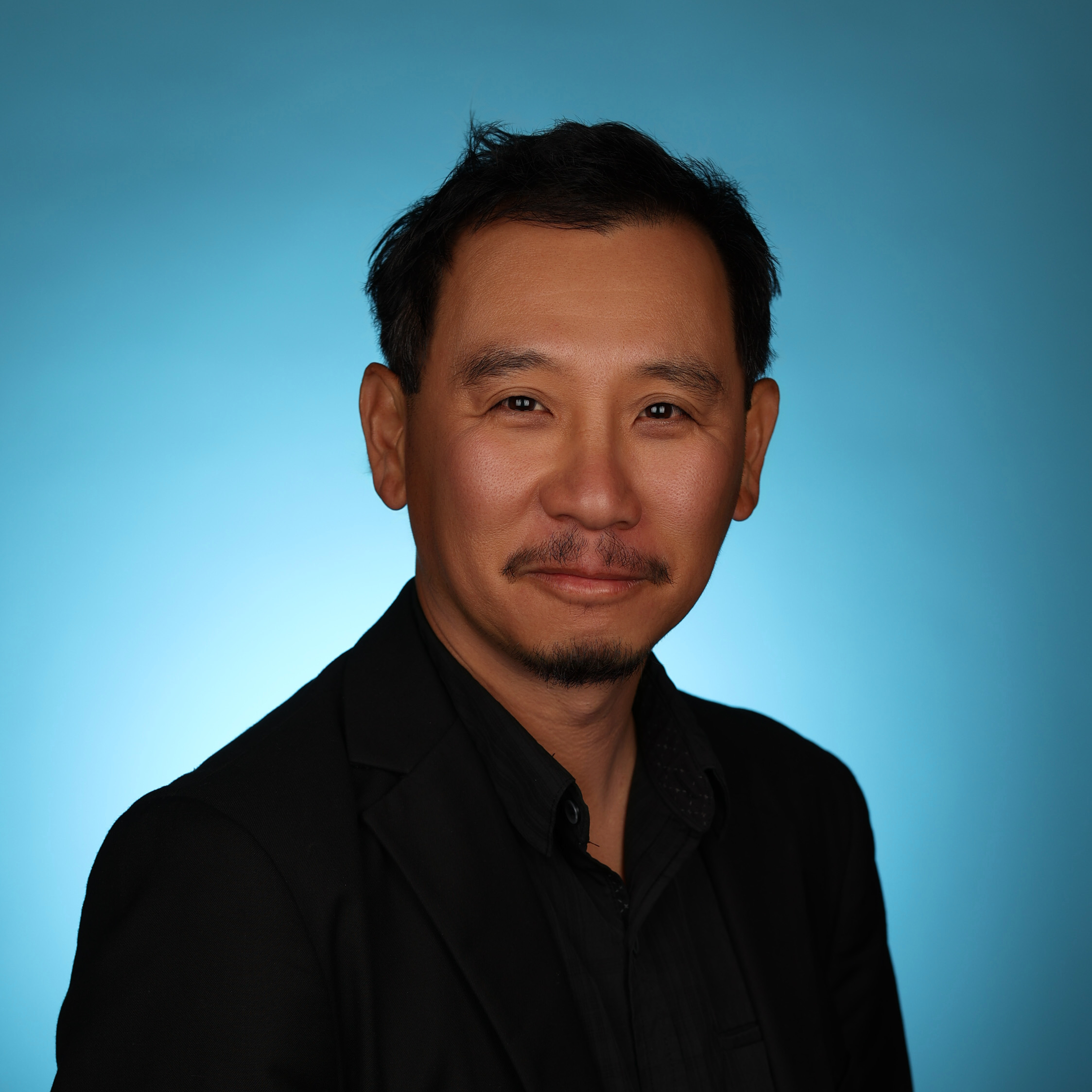 AI retouching example—authentic headshot with subtle enhancements